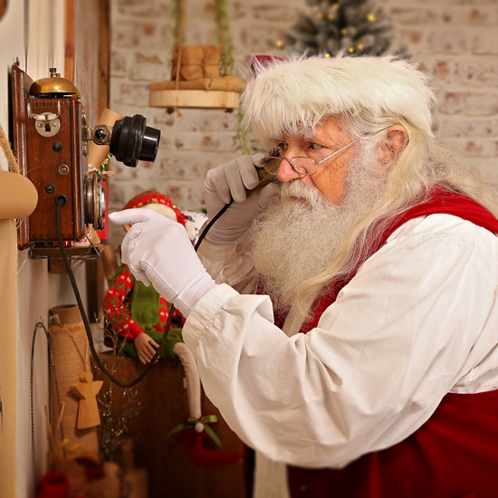 Santa making a call on a vintage phone